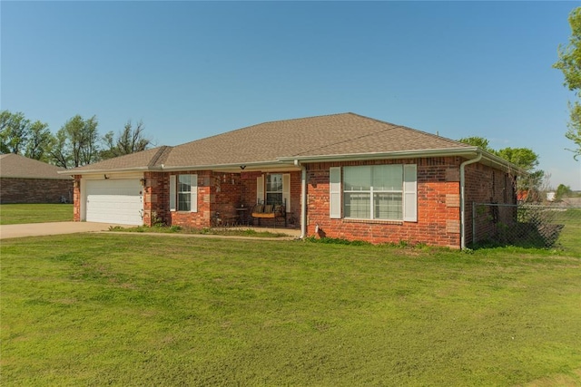 ranch-style house featuring a garage and a front yard