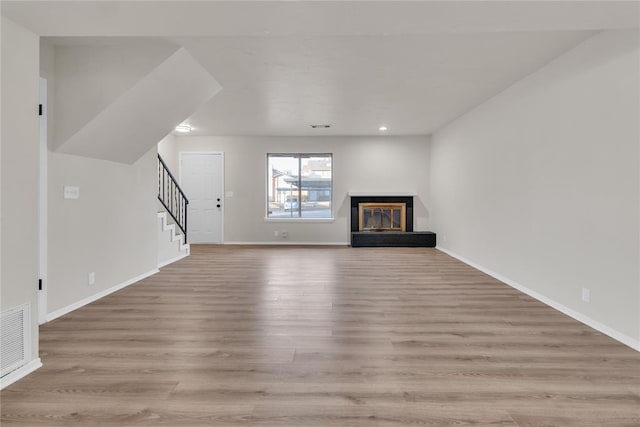 unfurnished living room featuring light hardwood / wood-style flooring