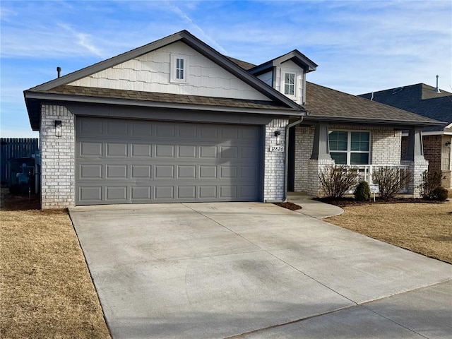 ranch-style home featuring a garage and a front yard