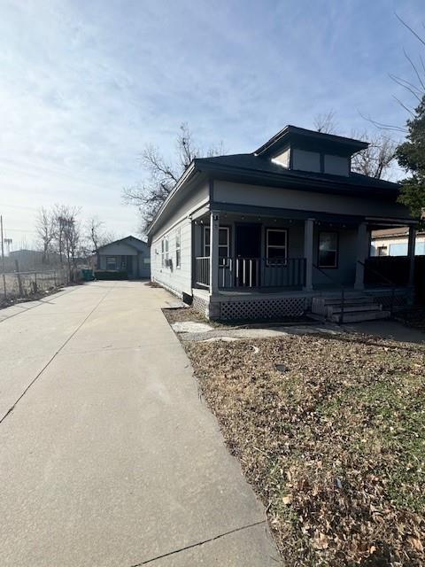 view of property exterior featuring a porch