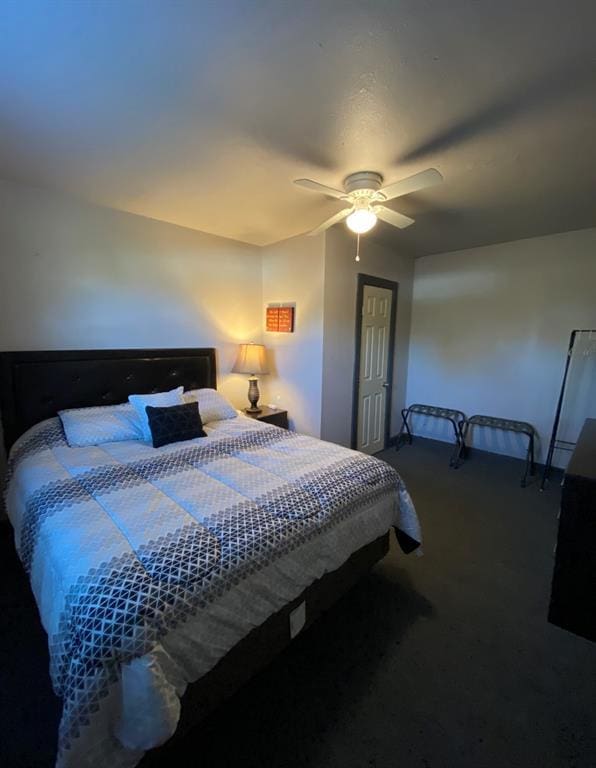 carpeted bedroom featuring ceiling fan