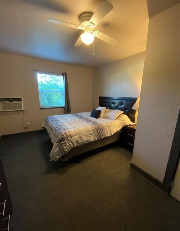 bedroom featuring ceiling fan, a wall mounted air conditioner, and dark carpet