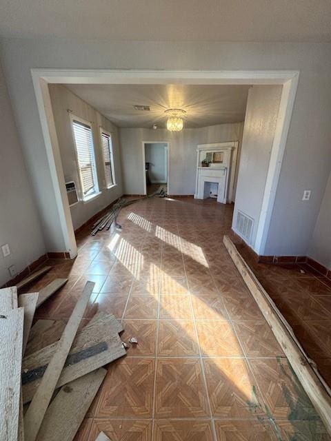 unfurnished living room with parquet floors