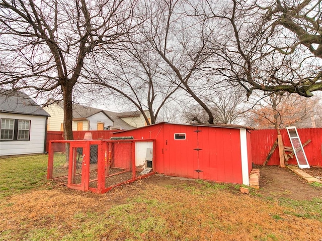 view of outbuilding featuring a yard