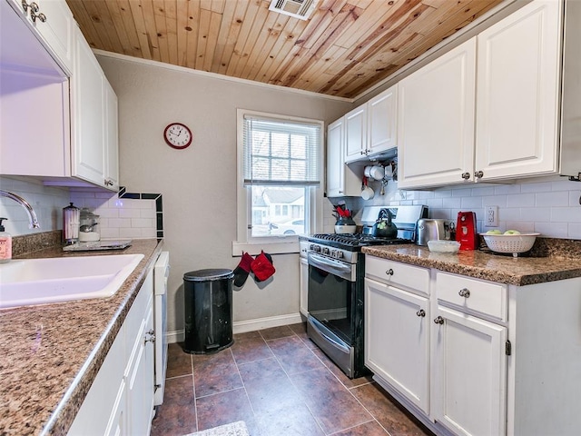 kitchen featuring wooden ceiling, sink, stainless steel range with gas stovetop, and white cabinets