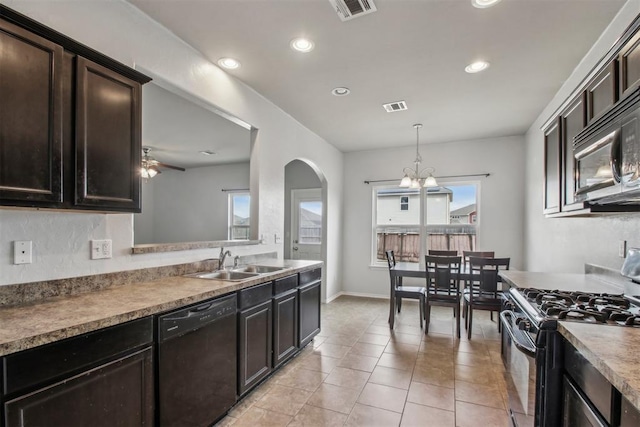 kitchen with dark brown cabinetry, sink, decorative light fixtures, light tile patterned floors, and black appliances