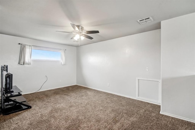 carpeted spare room with ceiling fan