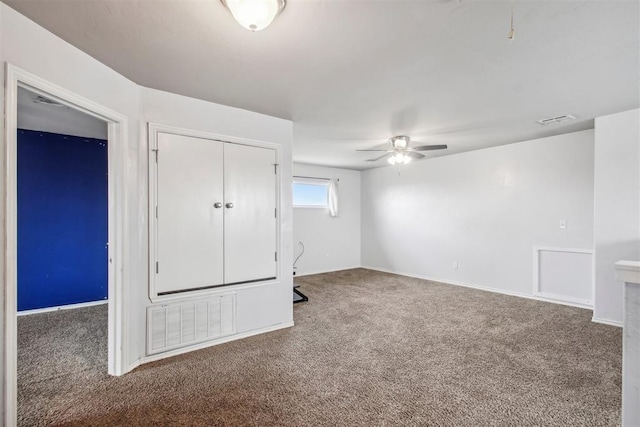 unfurnished bedroom featuring ceiling fan, carpet floors, and a closet