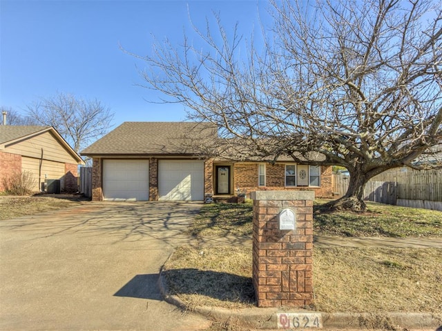 single story home featuring a garage and central AC