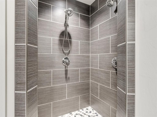 bathroom with a tile shower