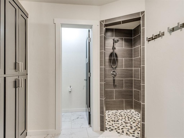 bathroom with tiled shower