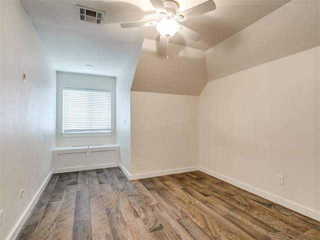 additional living space with hardwood / wood-style flooring, ceiling fan, and lofted ceiling