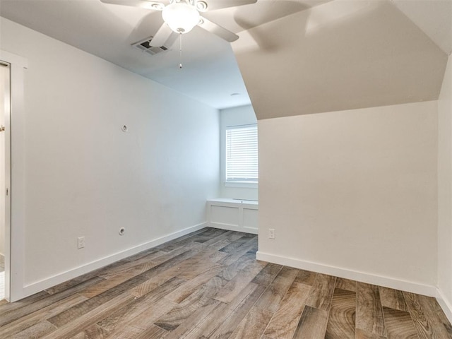 additional living space featuring hardwood / wood-style flooring and ceiling fan