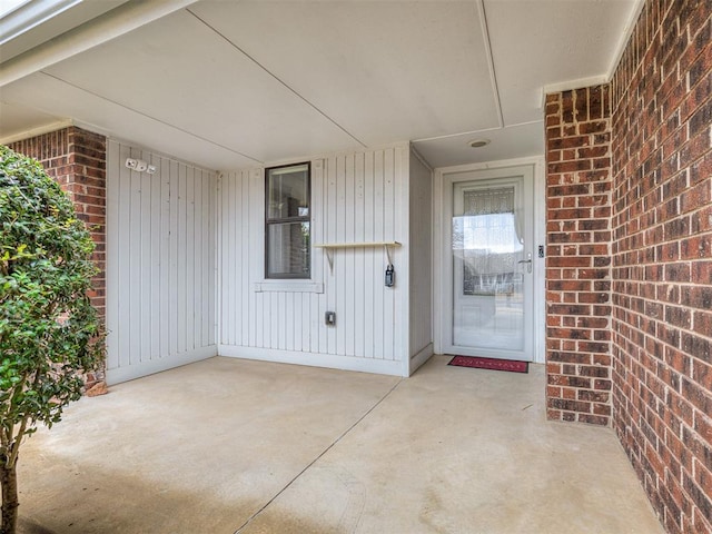 property entrance featuring a patio area