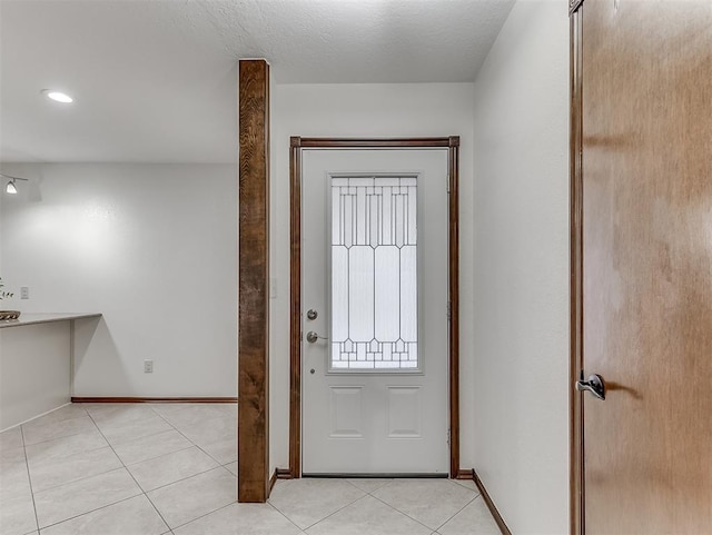 entrance foyer featuring light tile patterned floors