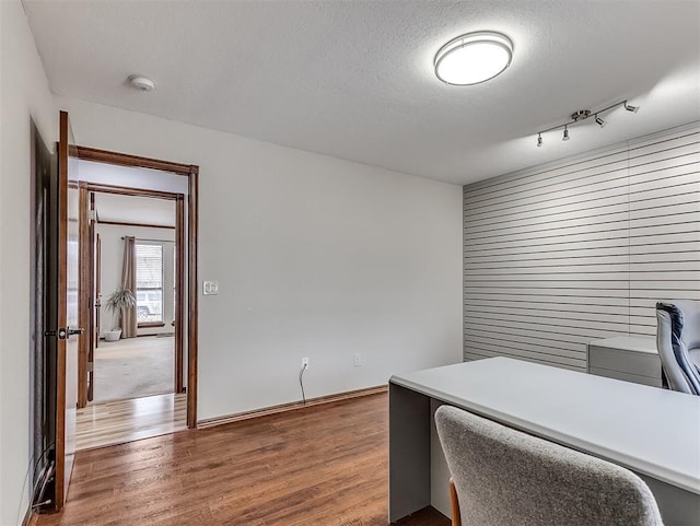 office area featuring hardwood / wood-style floors and a textured ceiling