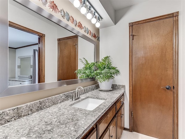 bathroom featuring vanity and crown molding