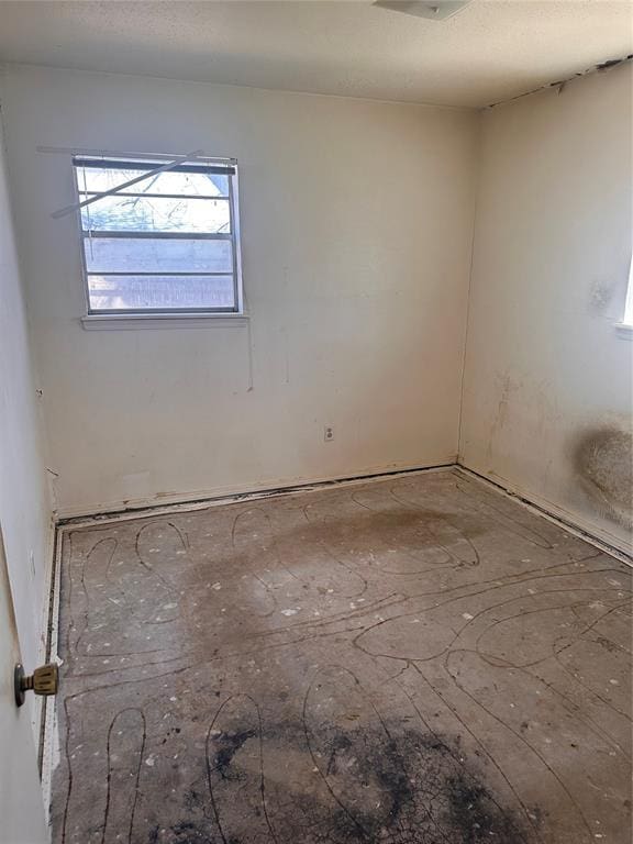 empty room with a textured ceiling