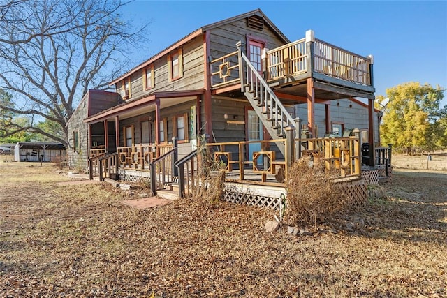 back of house with a wooden deck