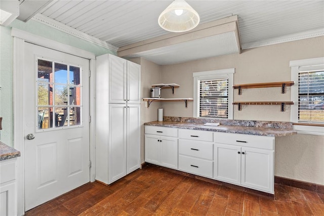 kitchen featuring white cabinetry, plenty of natural light, and dark wood-type flooring