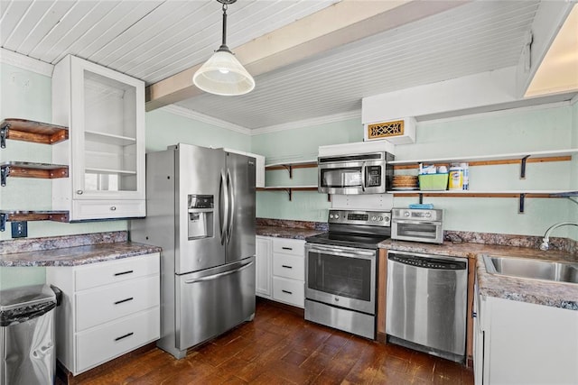 kitchen with white cabinetry, sink, decorative light fixtures, and appliances with stainless steel finishes