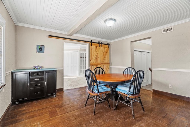 dining area with beamed ceiling, crown molding, a barn door, and dark hardwood / wood-style floors