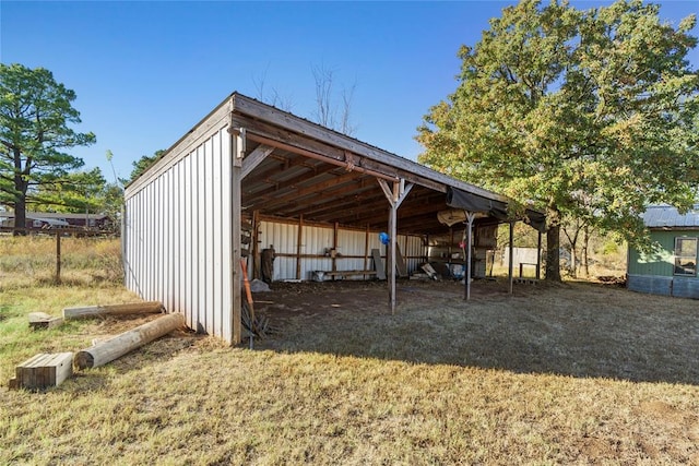 view of outbuilding with a yard