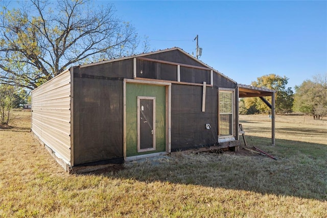 view of outdoor structure with a lawn