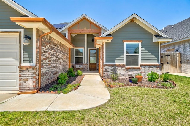 view of front of home featuring a garage and a front lawn