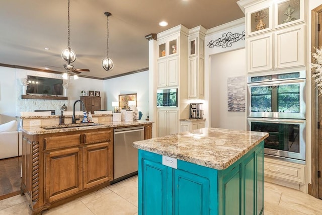 kitchen with sink, light stone counters, hanging light fixtures, a center island with sink, and appliances with stainless steel finishes