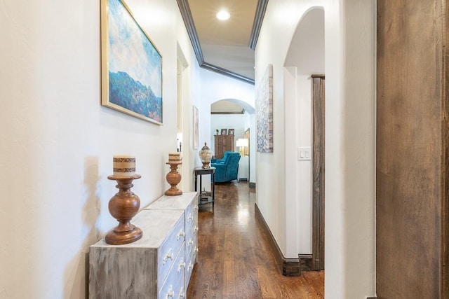 hall featuring dark wood-type flooring and ornamental molding