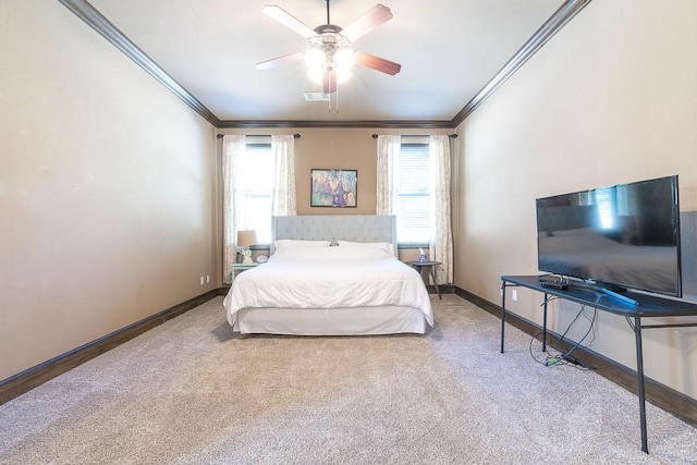 bedroom featuring crown molding, carpet floors, and ceiling fan