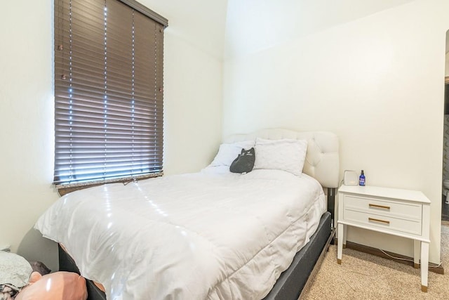 bedroom with light colored carpet