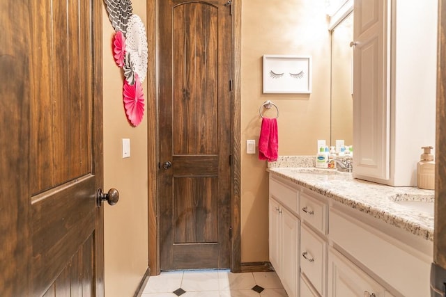 bathroom with vanity and tile patterned floors