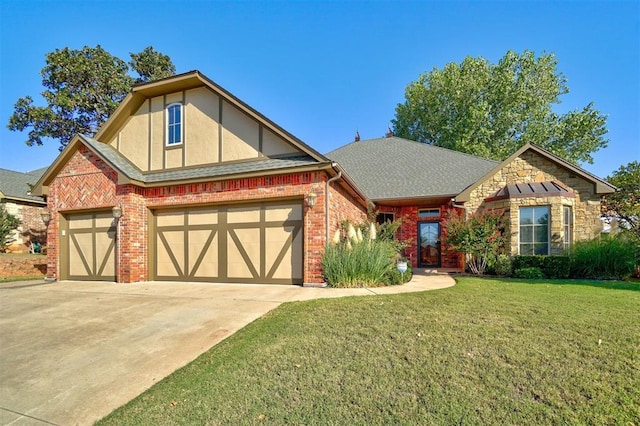 english style home with a garage and a front lawn