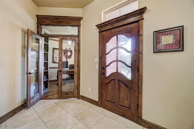 tiled foyer featuring french doors