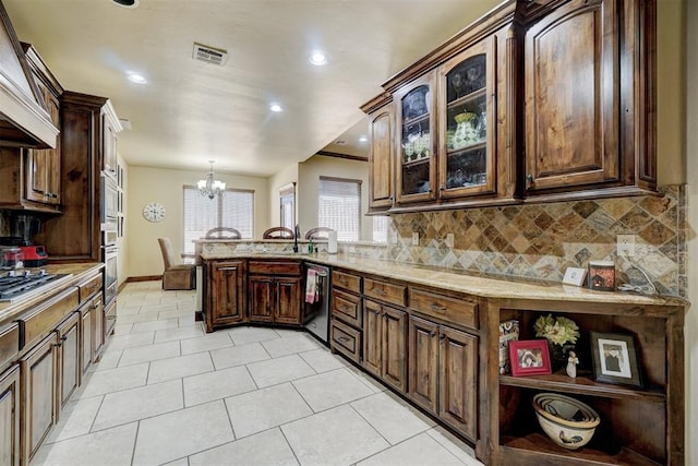 kitchen with tasteful backsplash, dark brown cabinetry, kitchen peninsula, stainless steel appliances, and custom range hood