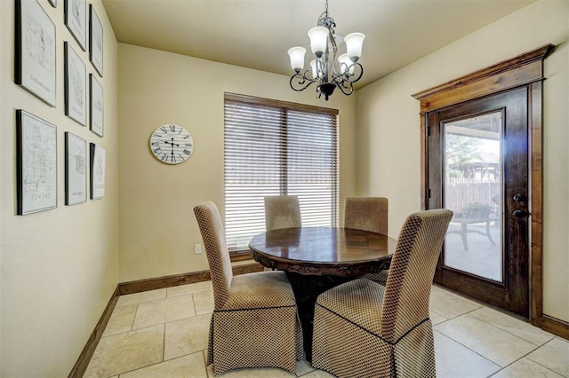 dining area featuring light tile patterned flooring and an inviting chandelier