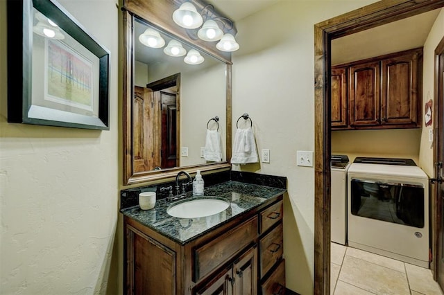 bathroom featuring vanity, tile patterned floors, and independent washer and dryer