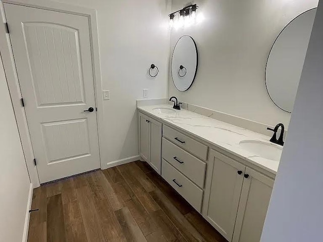 bathroom with vanity and hardwood / wood-style floors