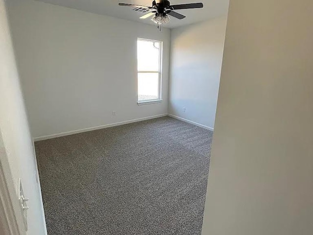 spare room with ceiling fan