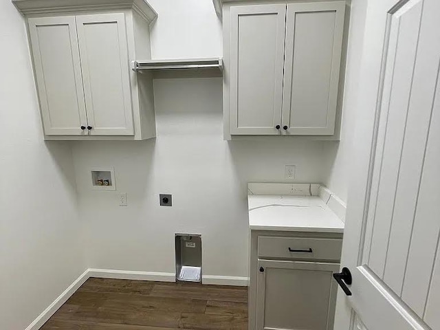 laundry room featuring dark wood-type flooring, cabinets, hookup for a washing machine, and electric dryer hookup