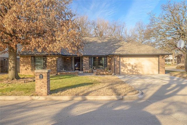 ranch-style house with a garage and a front yard