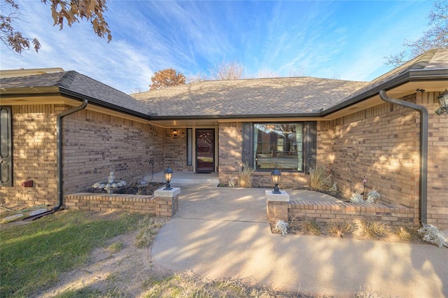 property entrance featuring a patio