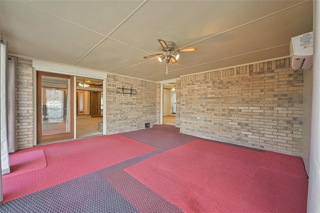 view of patio / terrace with an AC wall unit and ceiling fan