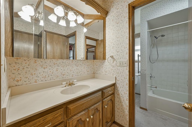 bathroom featuring vanity and tiled shower / bath combo