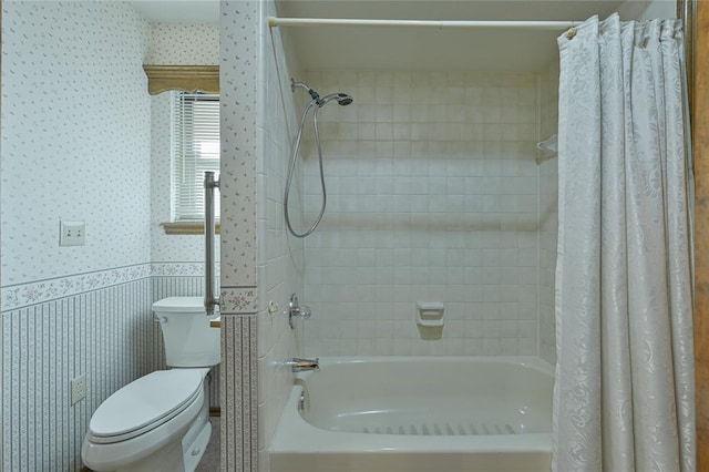 bathroom featuring shower / bath combination with curtain and toilet