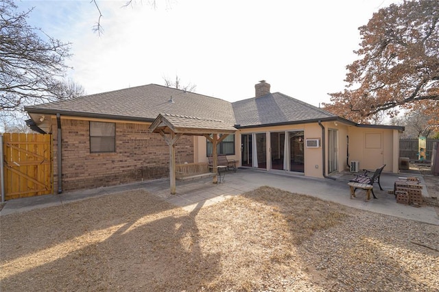 back of property featuring a patio