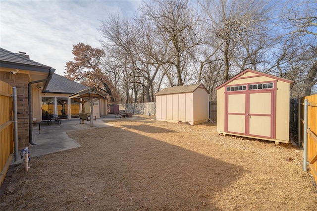 view of yard with a patio and a storage shed