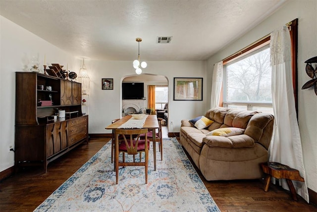 dining space featuring dark hardwood / wood-style floors